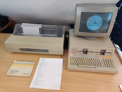 The Olivetti M20 showing a clock close to the Olivetti PR 1470 dot matrix printer